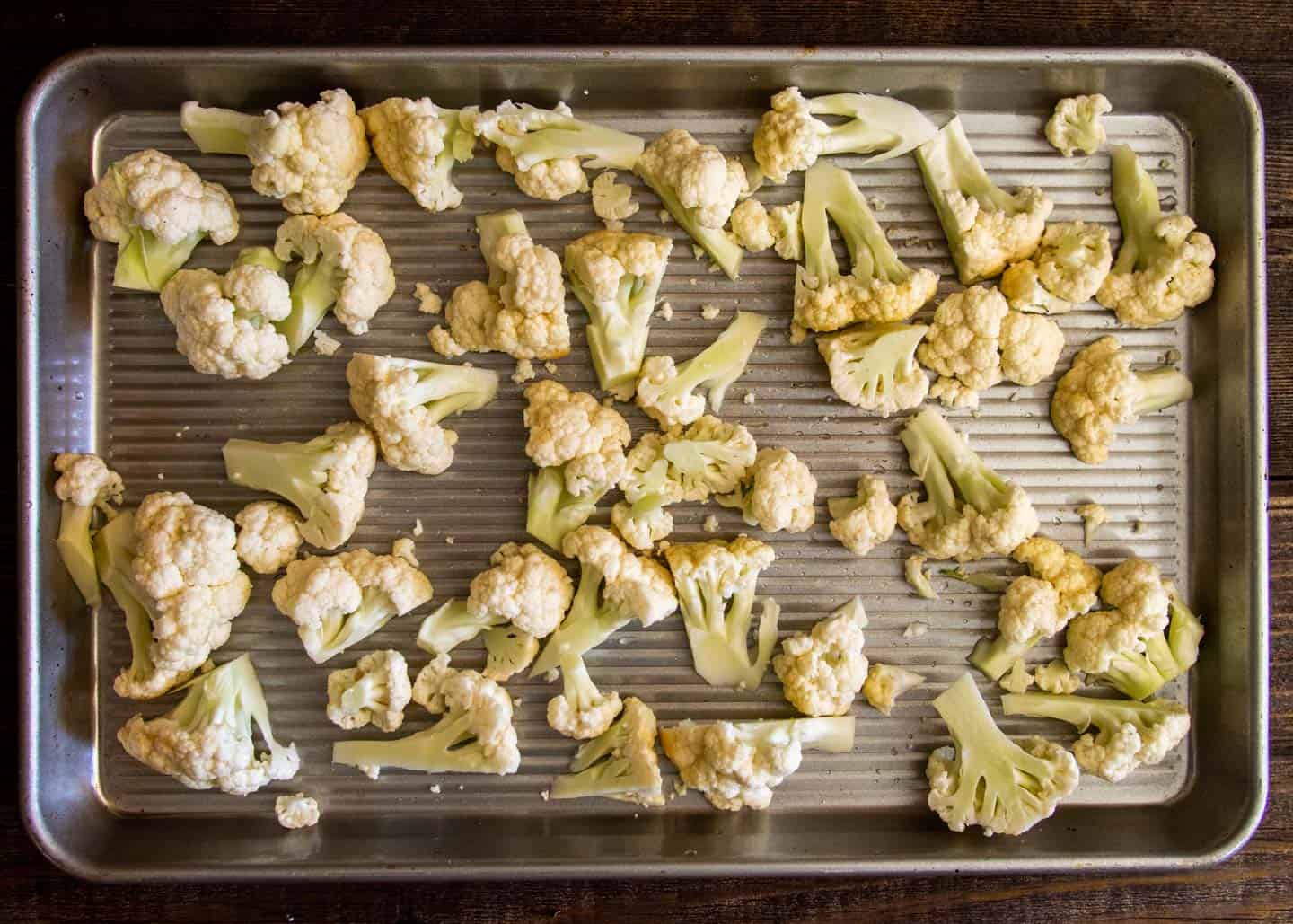 Chopped cauliflower on baking tray