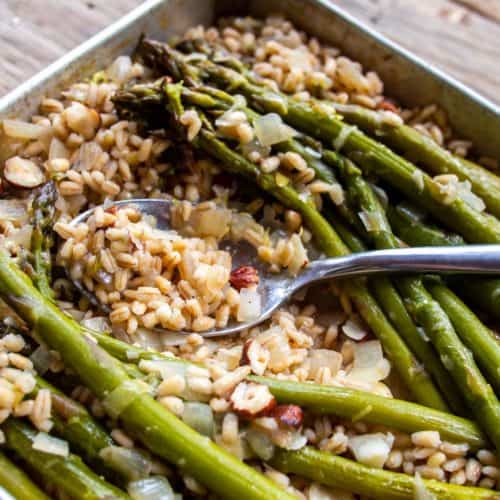 Baked Barley Risotto with Asparagus Pushed Aside with Spoon