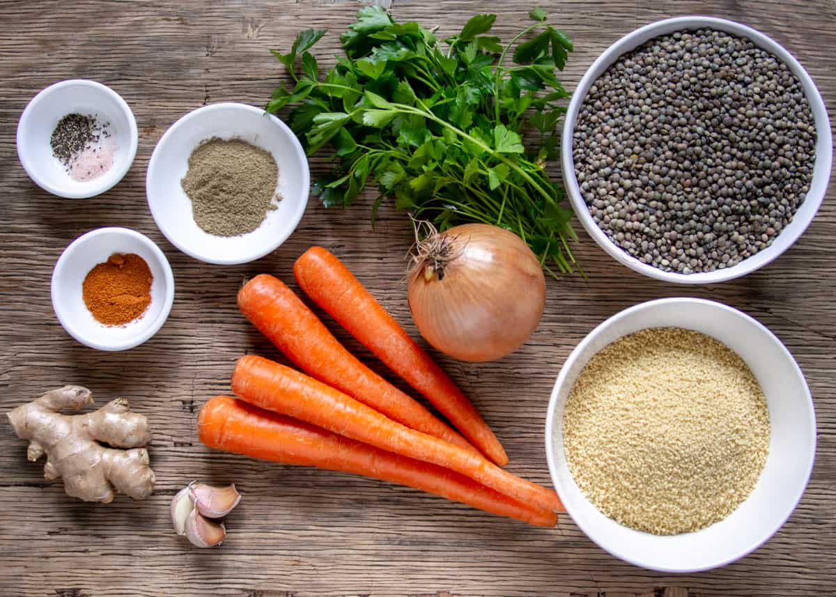 Ingredients for french lentil stew: ginger, garlic, onion, coriander, cayenne, carrots, couscous, lentils and parsley
