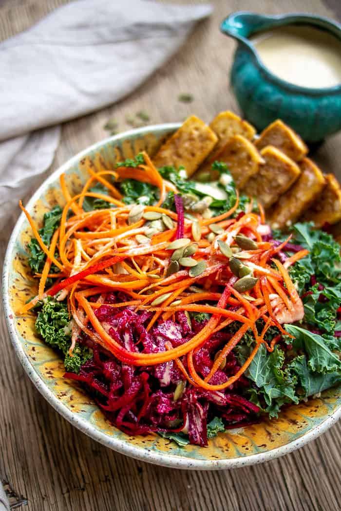 Close Up of Kale Salad Bowl with Baked Tofu and Glory Bowl Dressing