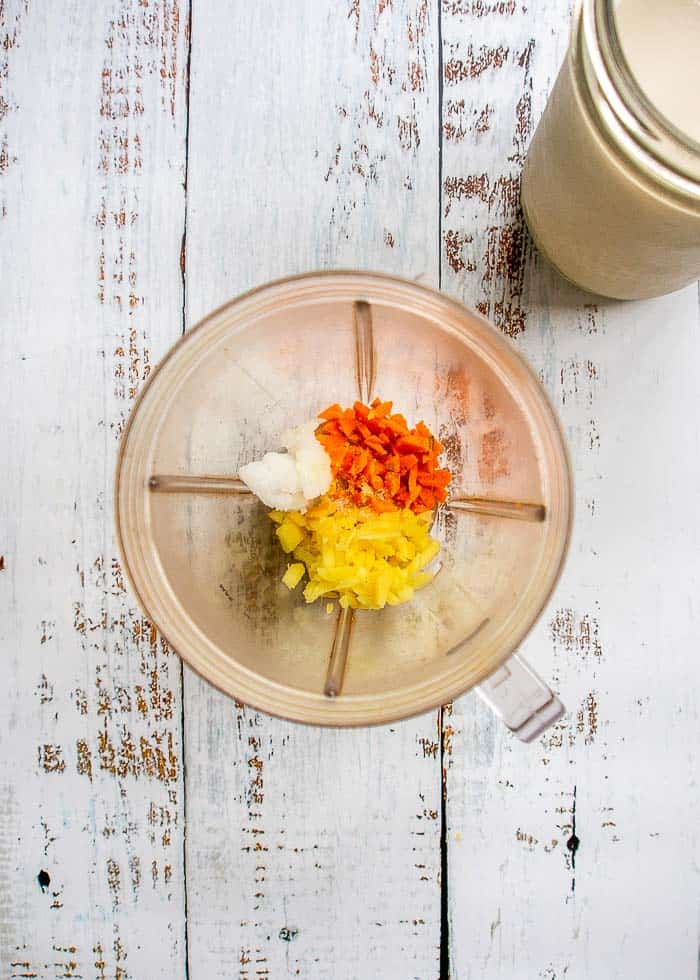 Minced ginger, turmeric and coconut oil in a blender