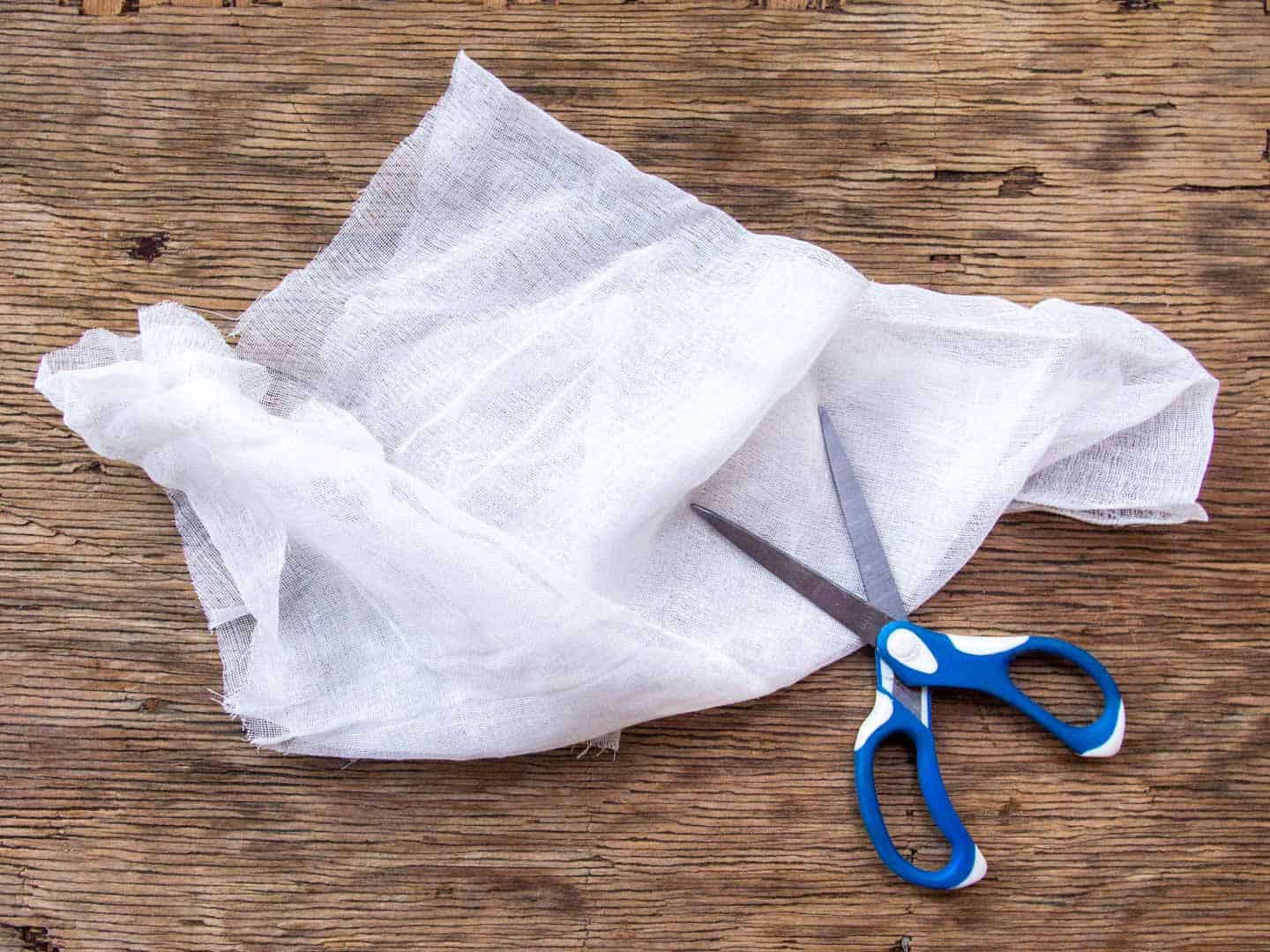 Cheesecloth with blue scissors 