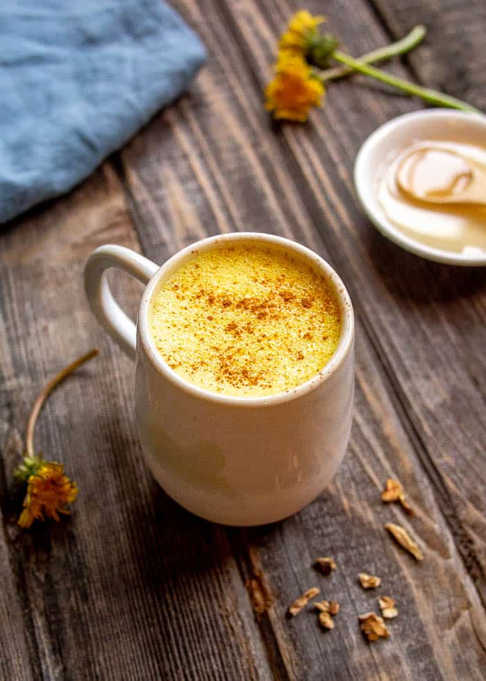 Dandelion Root Latte in White Mug with Dandelion Flowers - How To Heal Gut Naturally