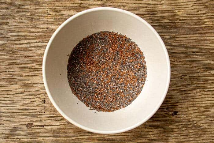 Mixing Water, Flax and Chia together in White Bowl