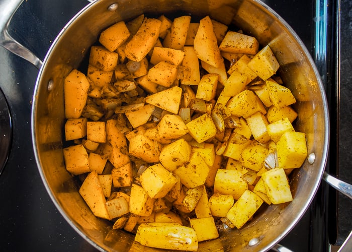 Butternut Squash and Curry Spices Frying in Large Pot