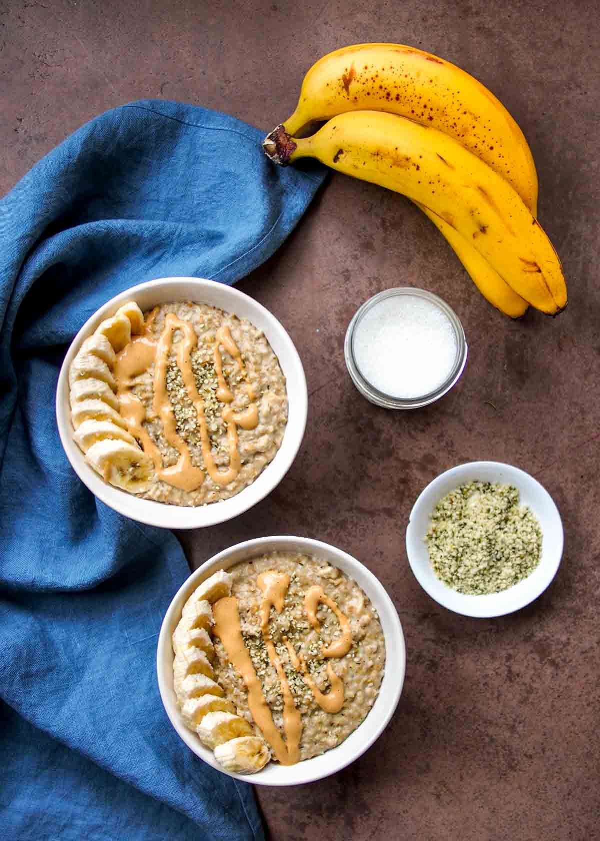 Two Bowls Of Steel-Cut Oats with Drizzle Of Peanut Butter