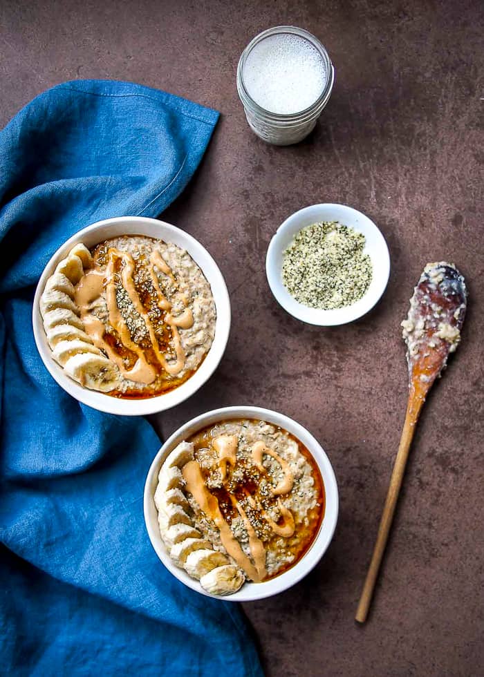 High Protein Steel-Cut Oats with Peanut Butter Recipe in Bowls with Blue Linen