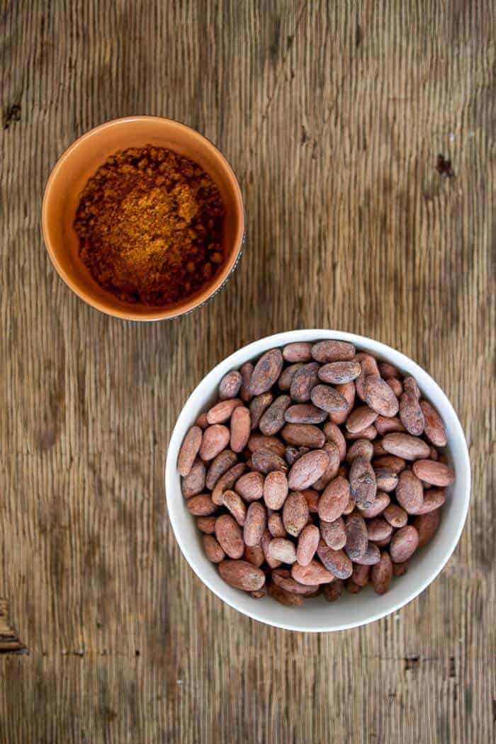Cacao Beans in White Bowl with Raw Cane Sugar