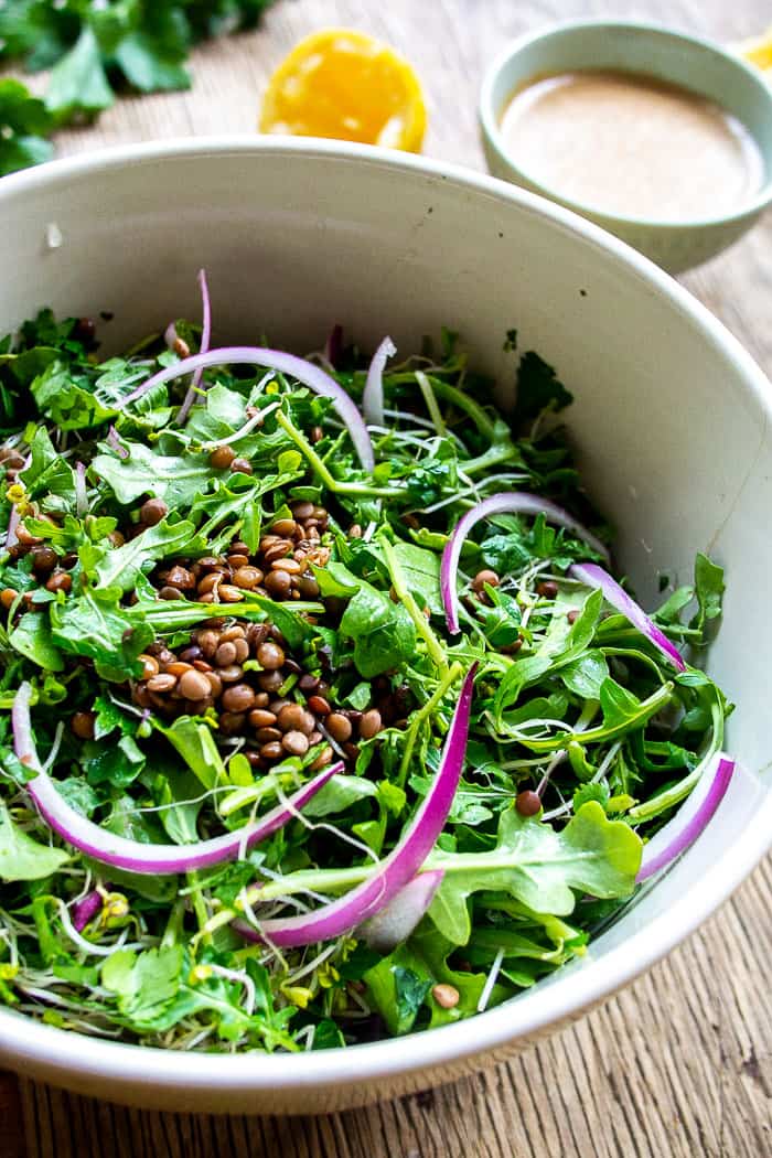 Close Up of Lentil Salad with Red Onion and Arugula