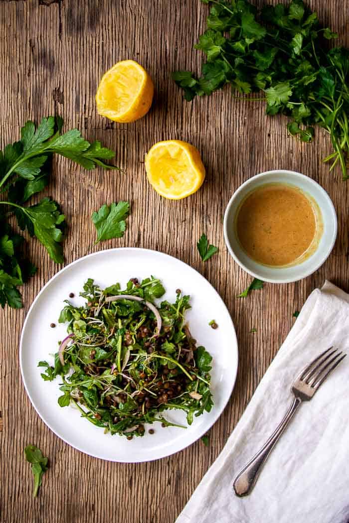 Lentil Salad on White Plate with Squeezed Lemons