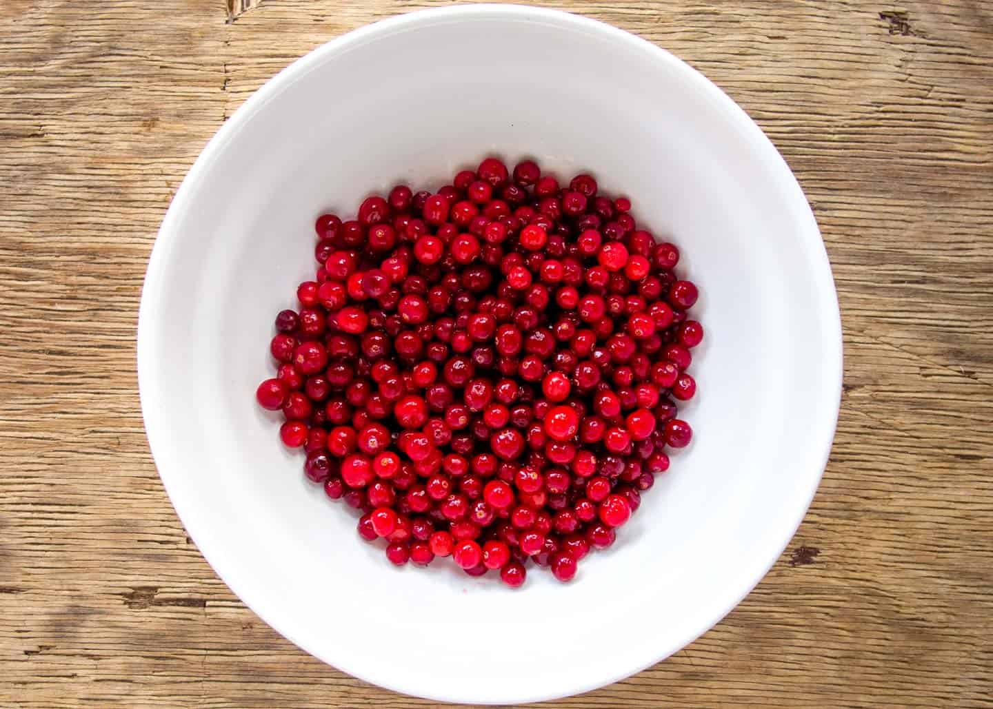 white bowl of low bush cranberries