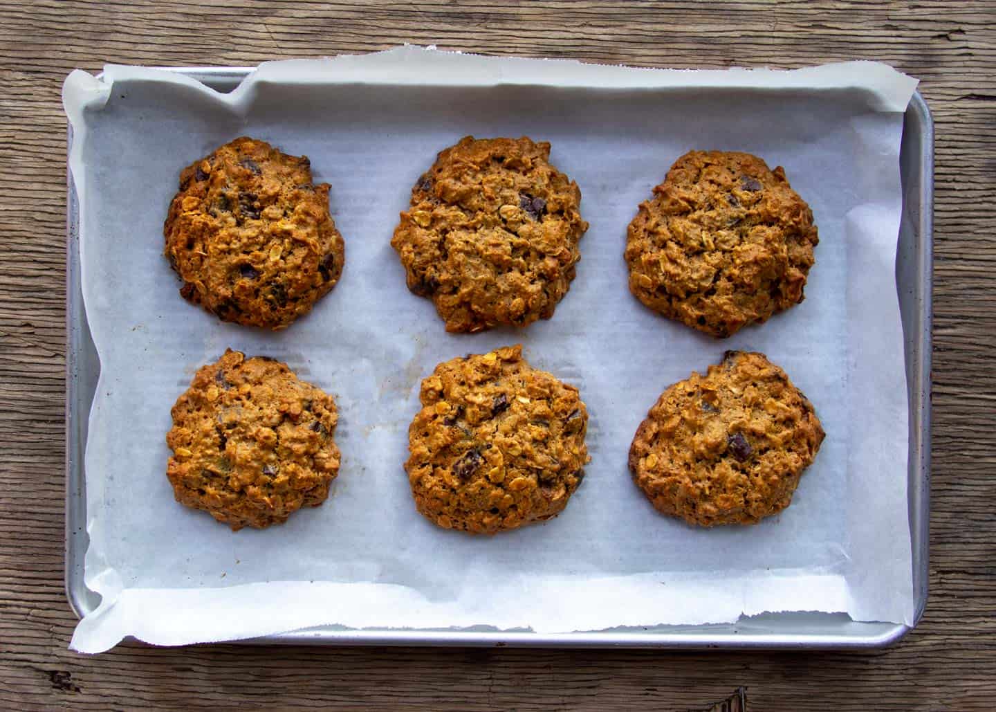 baked peanut butter oatmeal cookies on baking tray.